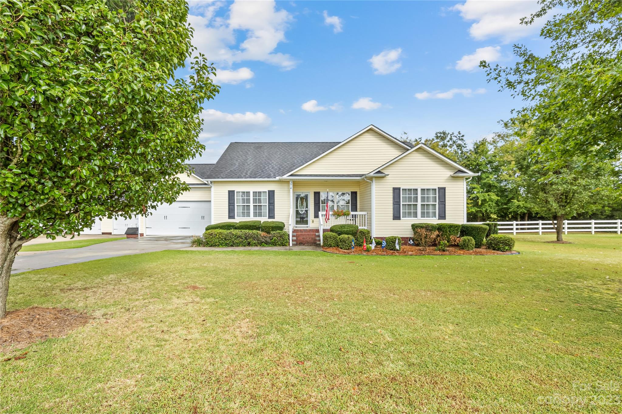 374 Owens Road Clover, SC 29710 - Photo 1 of 42 a front view of a house with swimming pool having outdoor seating