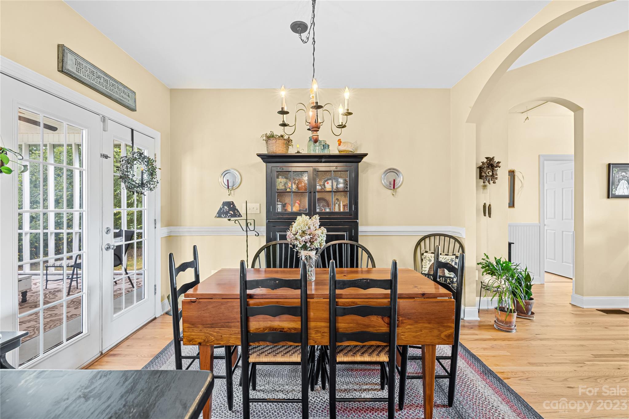 374 Owens Road Clover, SC 29710 - Photo 11 of 42 a dining room with furniture potted plants and wooden floor
