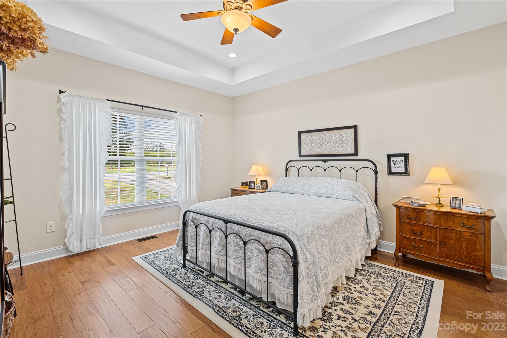 374 Owens Road Clover, SC 29710 - Photo 13 of 42 a bedroom with a bed a dresser with wooden floor