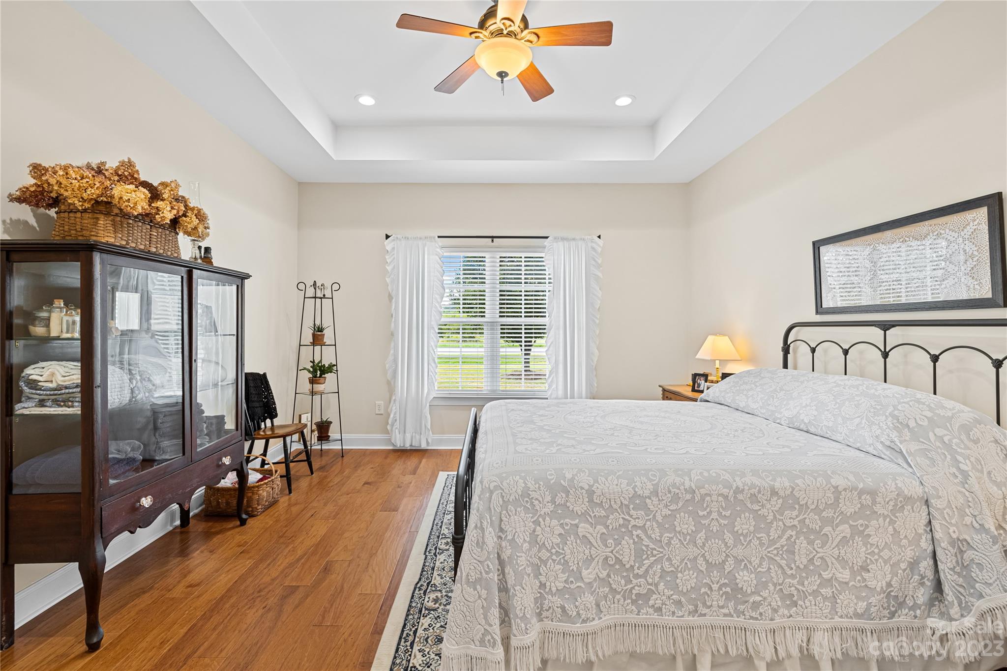 374 Owens Road Clover, SC 29710 - Photo 14 of 42 a spacious bedroom with a large bed and a chandelier