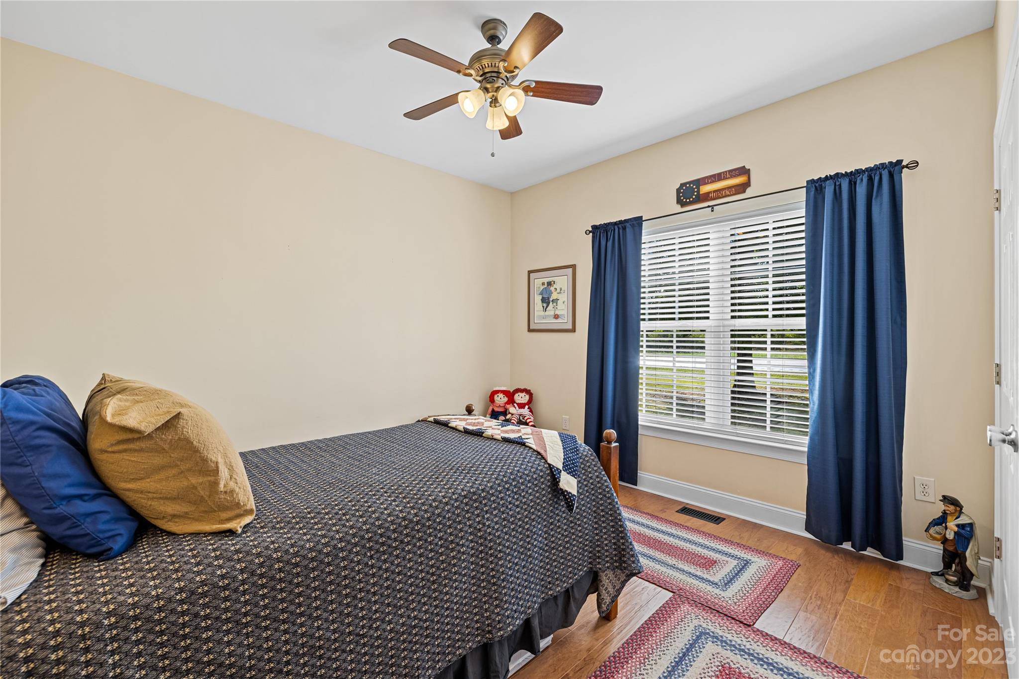 374 Owens Road Clover, SC 29710 - Photo 18 of 42 a bedroom with a bed and a chandelier