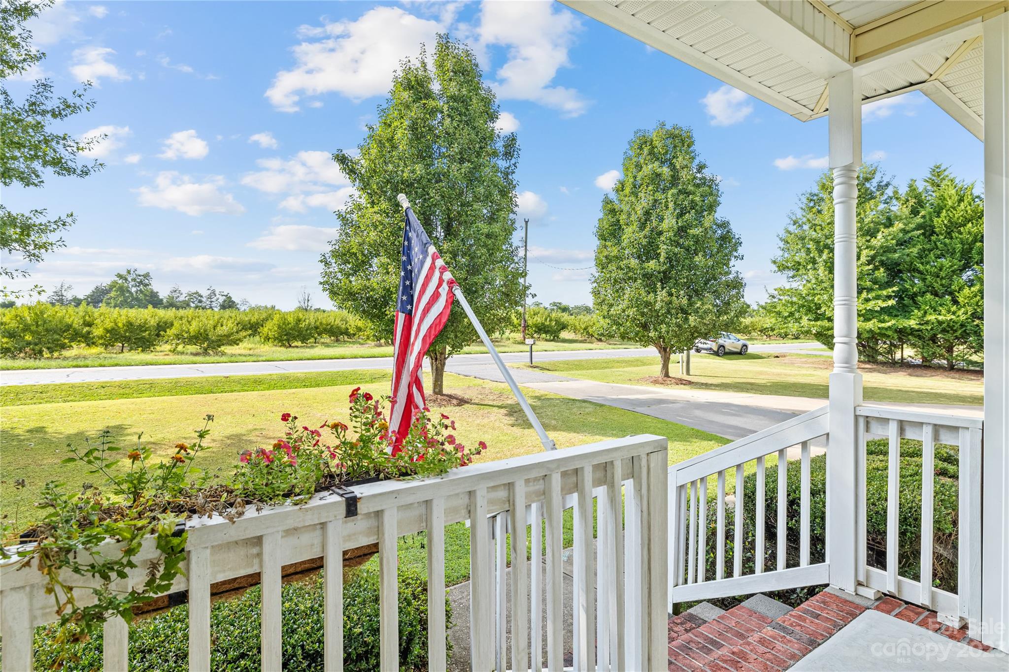 374 Owens Road Clover, SC 29710 - Photo 3 of 42 a view of a balcony with lake view and a floor to ceiling window next to a yard