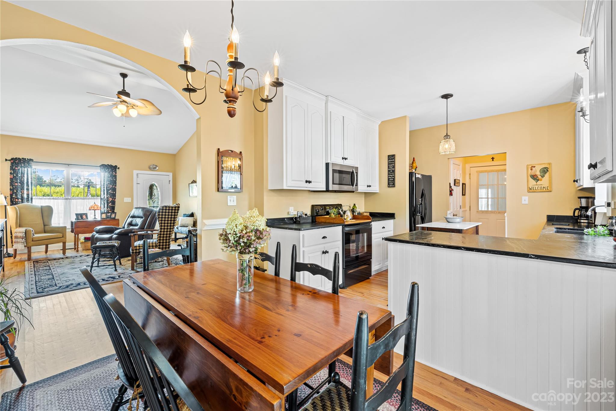 374 Owens Road Clover, SC 29710 - Photo 8 of 42 a dining room filled chandelier and kitchen view