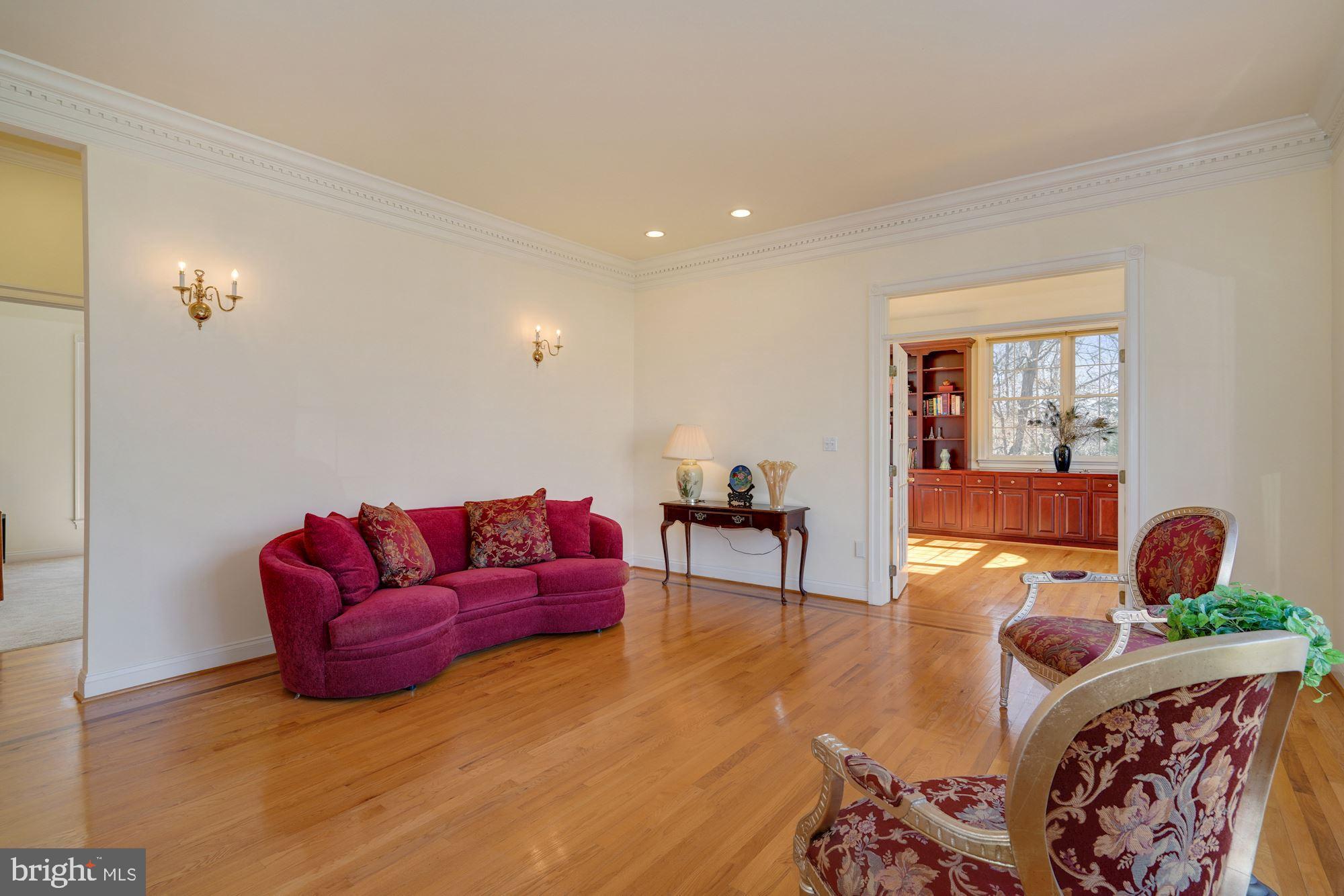 11210 Albermyrtle Road Potomac, MD 20854 - Photo 6 of 59 Living room featuring bordered hardwood flooring