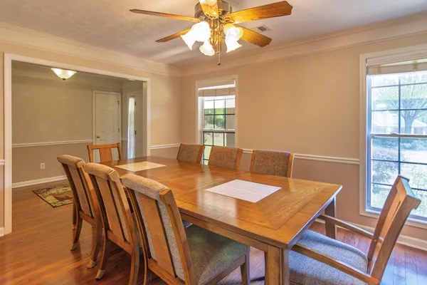 a view of a dining room with furniture window and outside view