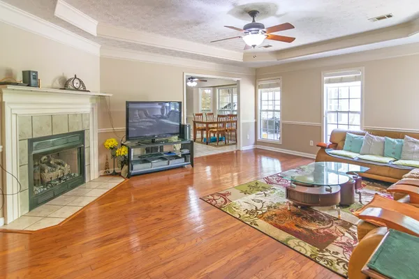 a kitchen with stainless steel appliances granite countertop a refrigerator and a stove