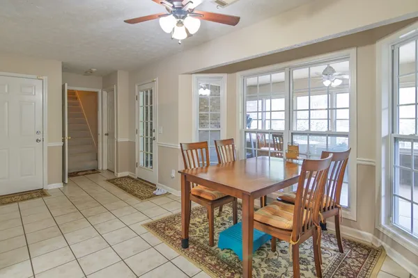 a kitchen with stainless steel appliances granite countertop a refrigerator and a stove