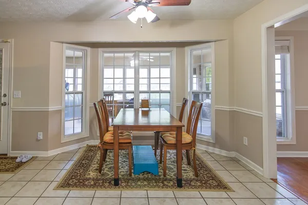a view of a dining room with furniture window and outside view