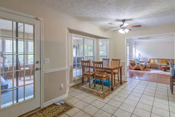 a view of a livingroom with furniture and a window