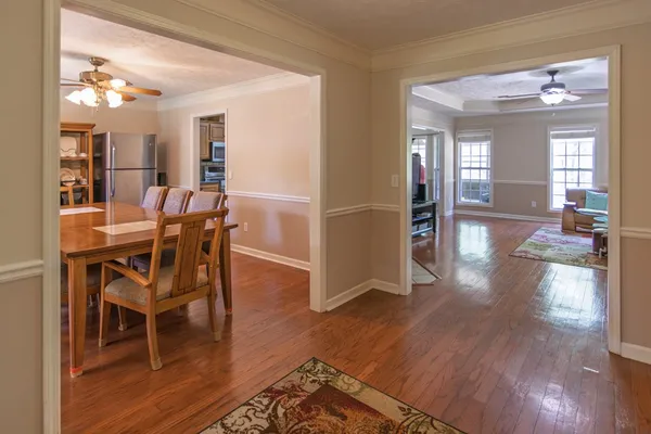 a view of a dining room with furniture window and wooden floor