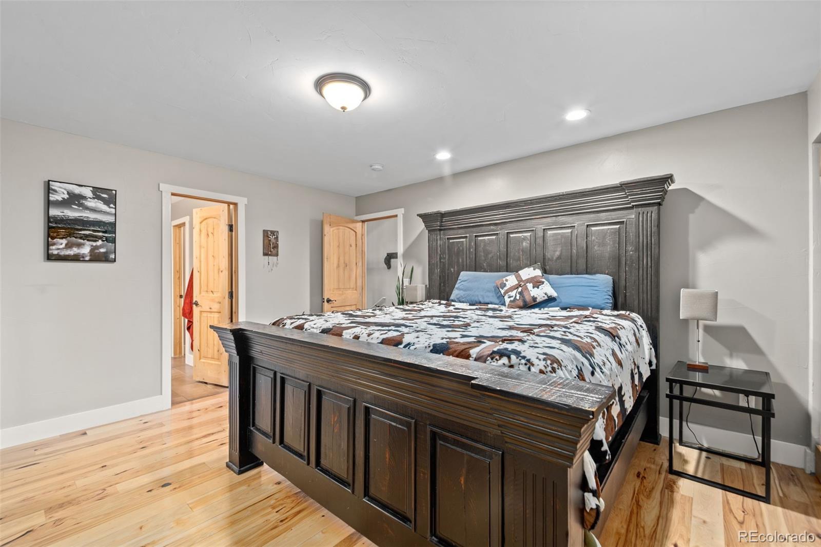 258 Upper Forest Road Idaho Springs, CO 80452 - Photo 20 of 48 a bedroom with a bed and a dresser