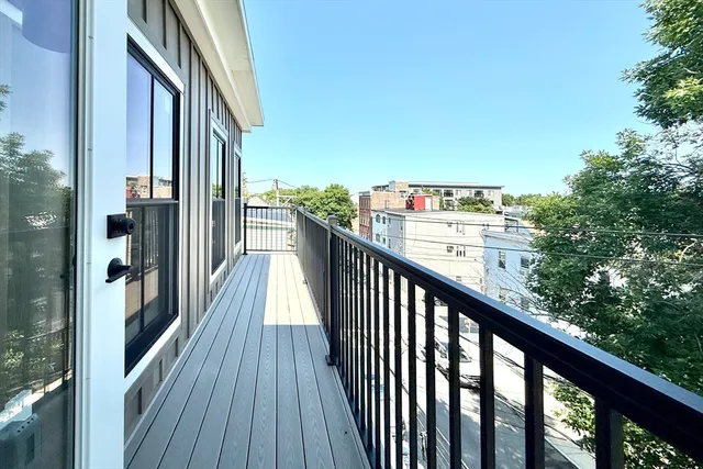 a view of a balcony with wooden floor