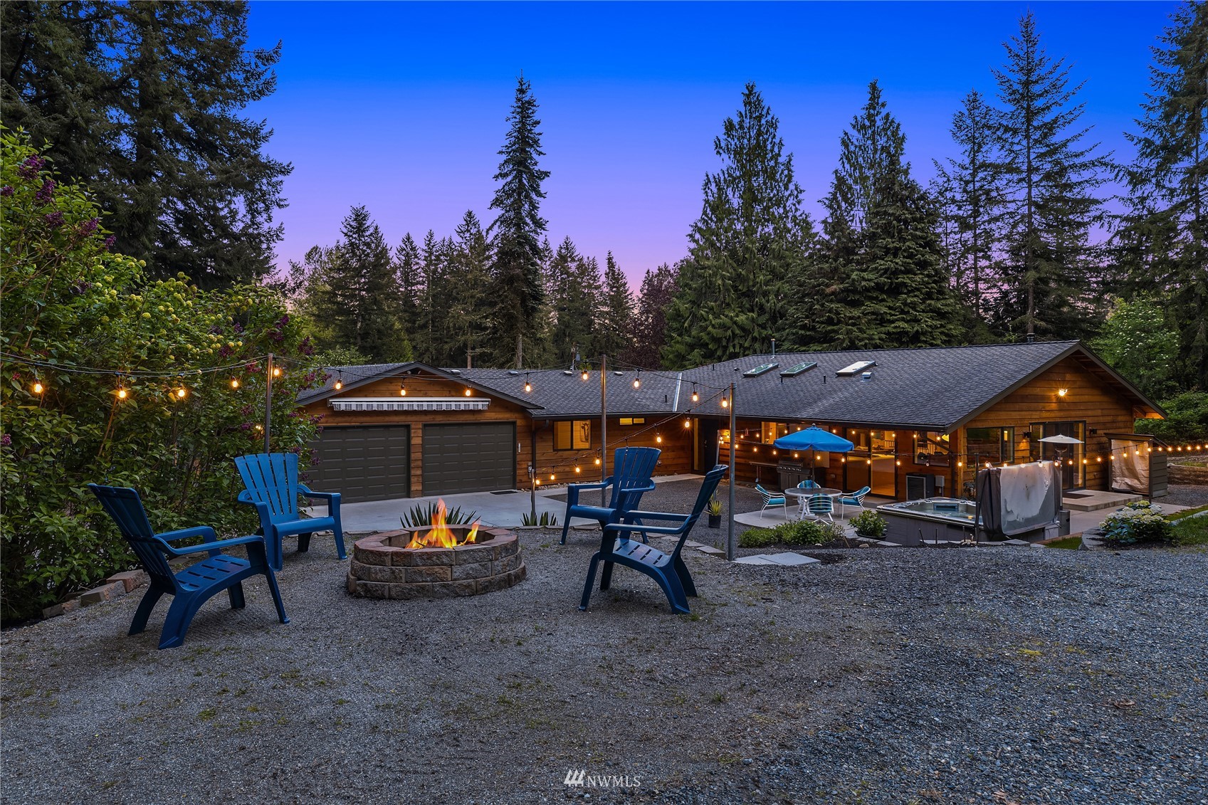 a view of a patio with furniture and a backyard