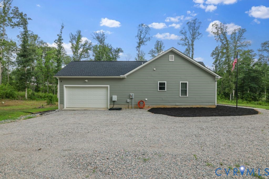 3259 Three Bridge Road Powhatan, VA 23139 - Photo 32 of 43 Detached garage with light green siding, a large w
