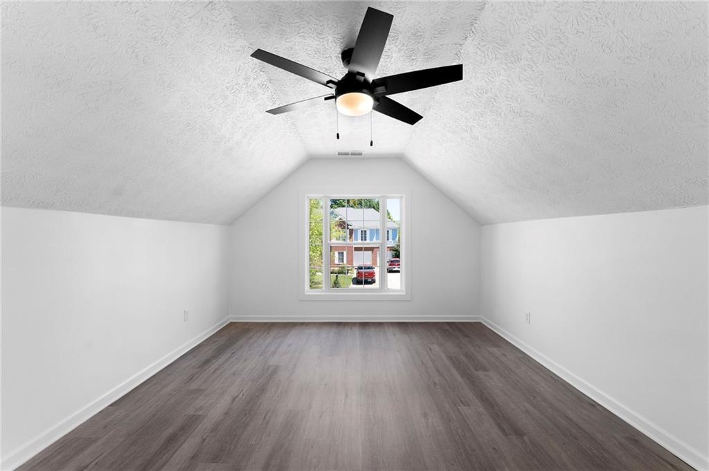 20 Mallet Pointe Street Northeast Cartersville, GA 30121 - Photo 33 of 37 an empty room with a window and a ceiling fan