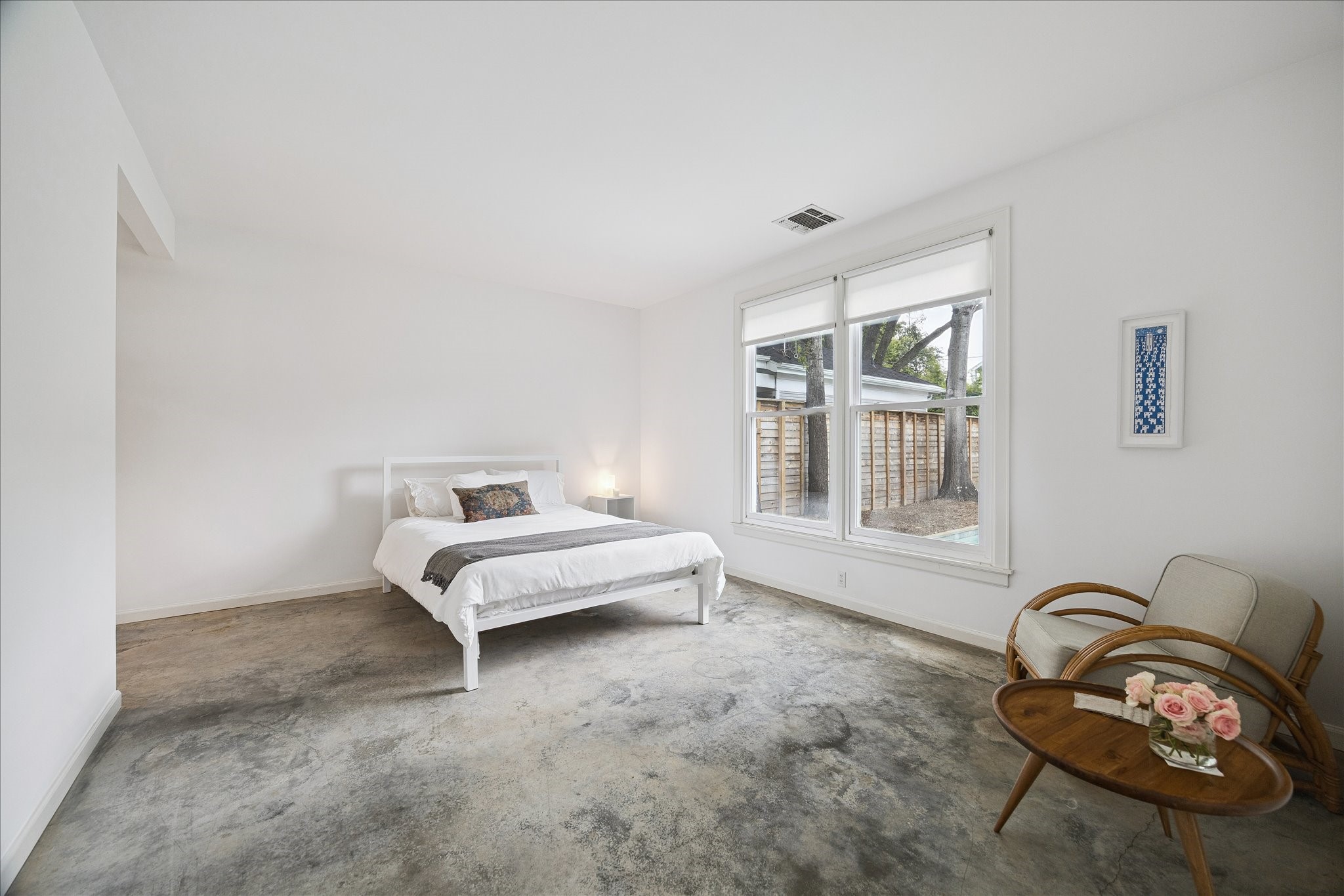 1418 Kipling Street Houston, TX 77006 - Photo 29 of 42 Private secondary bedroom boasts cool concrete floors and lots of natural light.