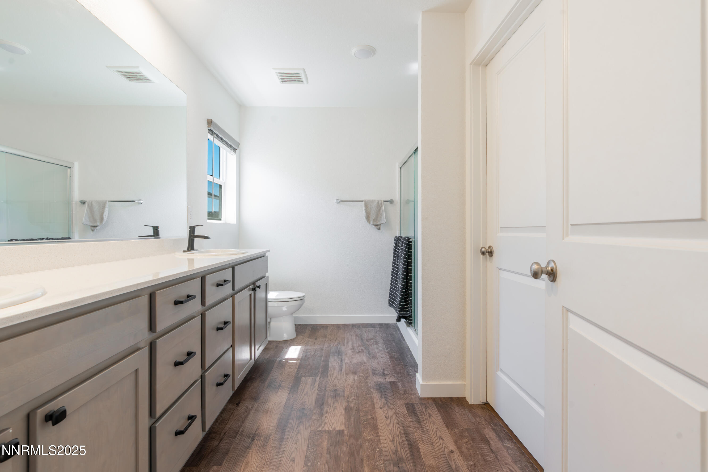 102 Halite Drive Dayton, NV 89403 - Photo 14 of 34 a spacious bathroom with a double vanity sink a mirror and a shower