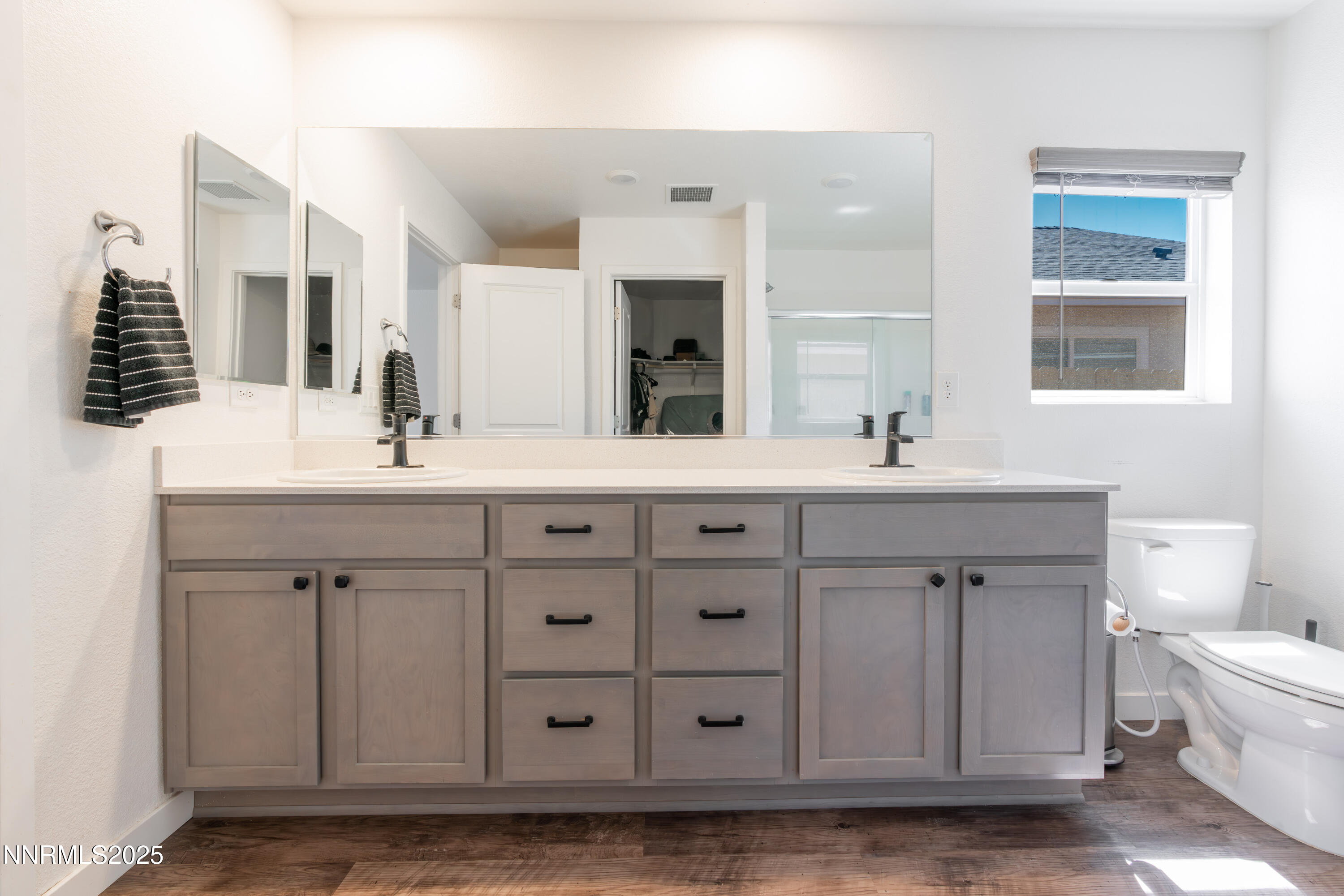 102 Halite Drive Dayton, NV 89403 - Photo 15 of 34 a bathroom with a sink vanity and mirror