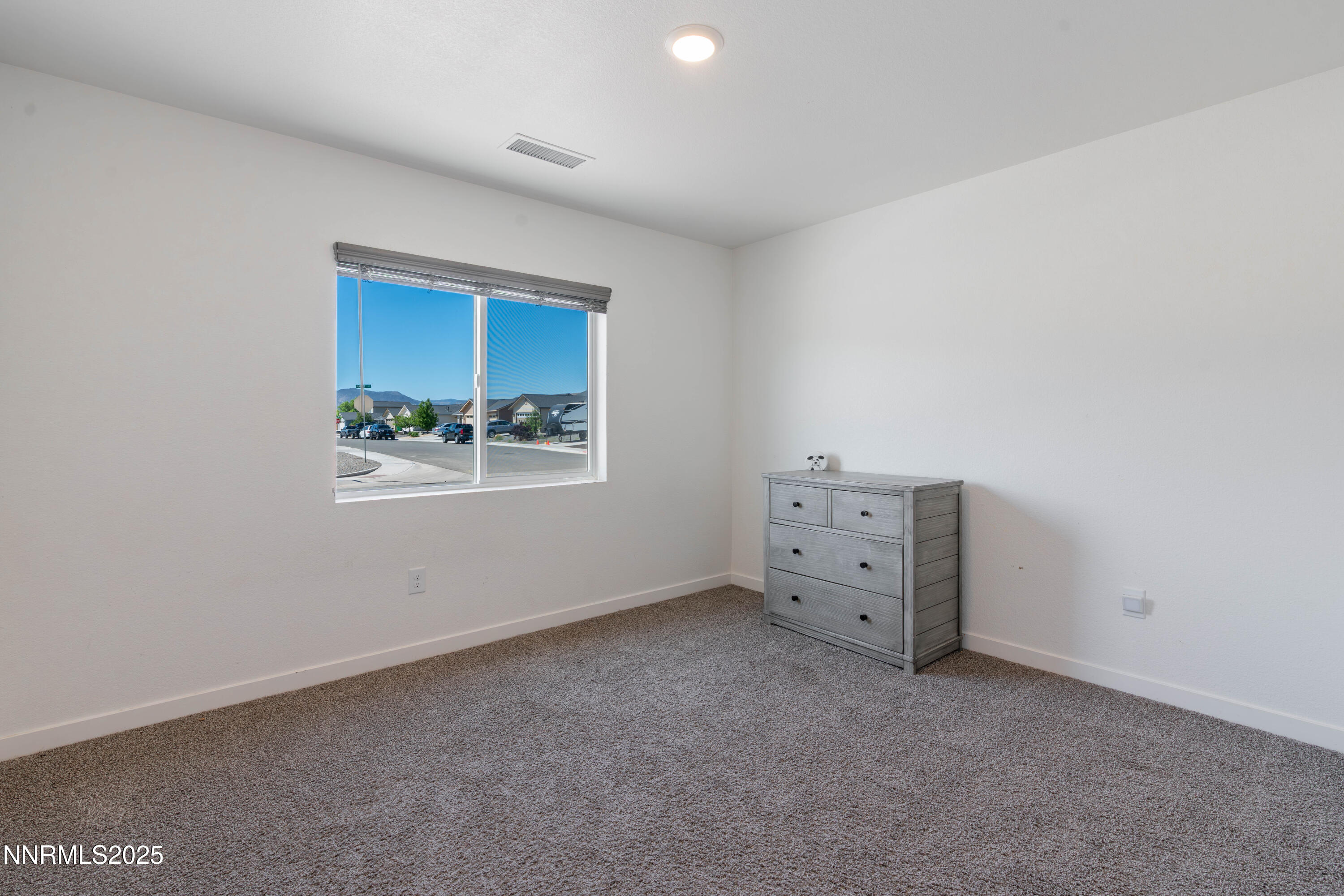 102 Halite Drive Dayton, NV 89403 - Photo 19 of 34 an empty room with a window and cabinet