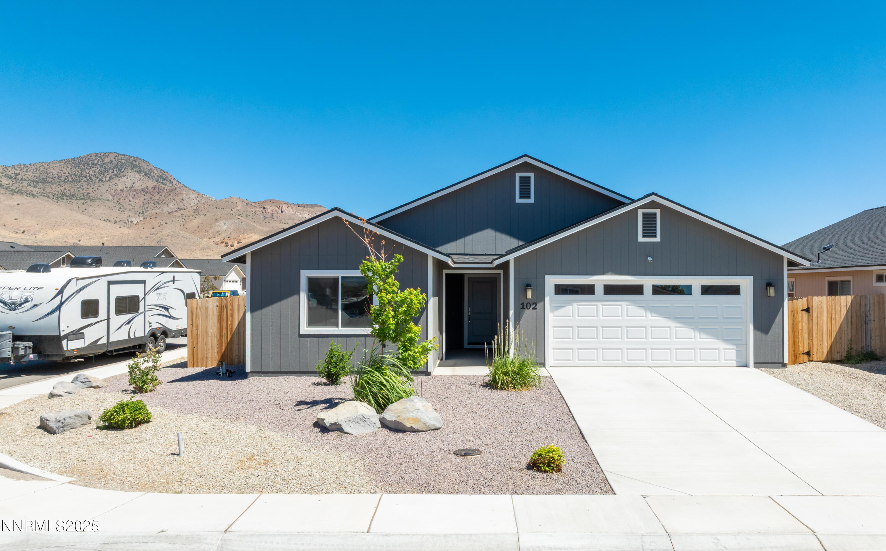 102 Halite Drive Dayton, NV 89403 - Photo 2 of 34 a front view of a house with a yard