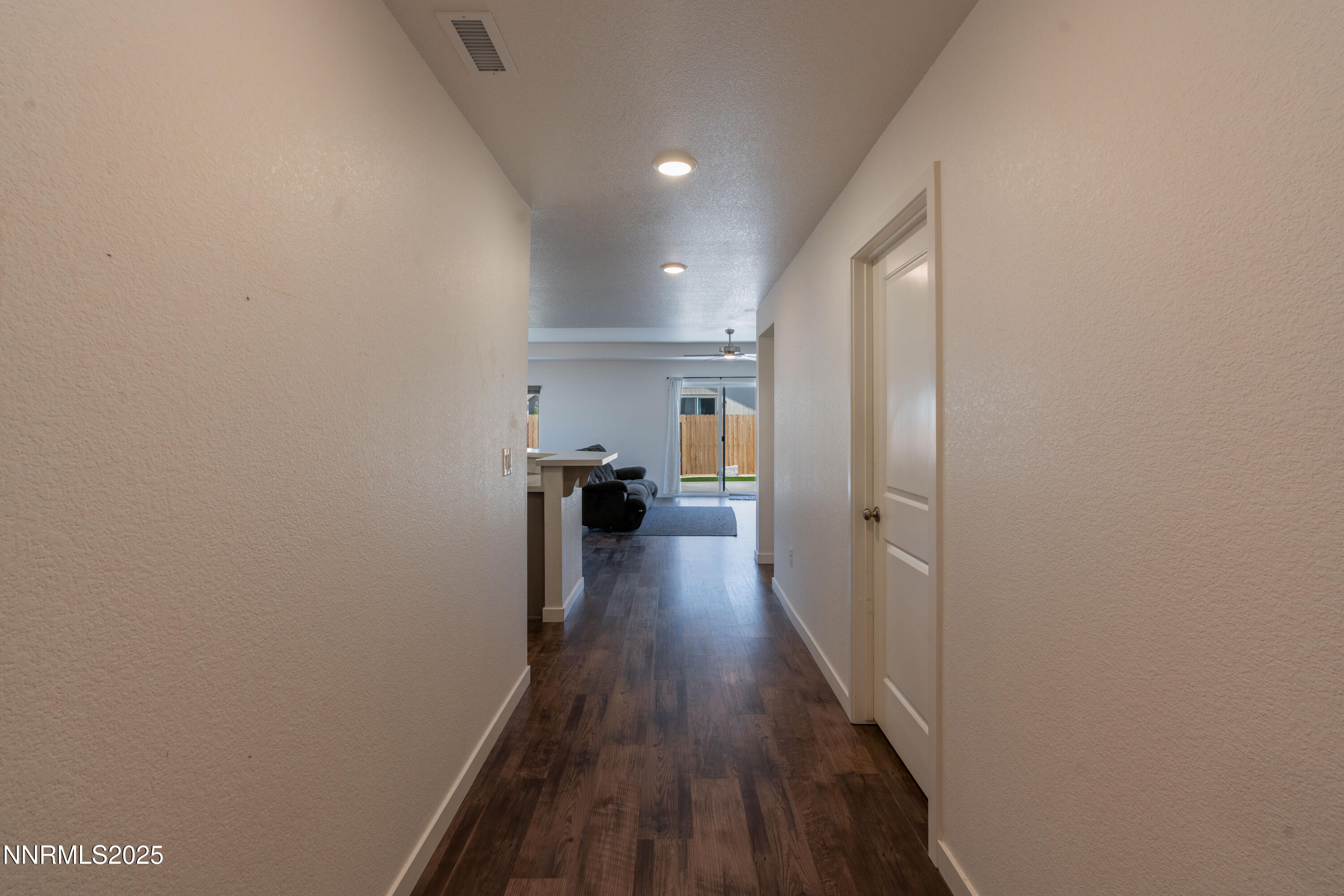 102 Halite Drive Dayton, NV 89403 - Photo 6 of 34 a view of a hallway with wooden floor