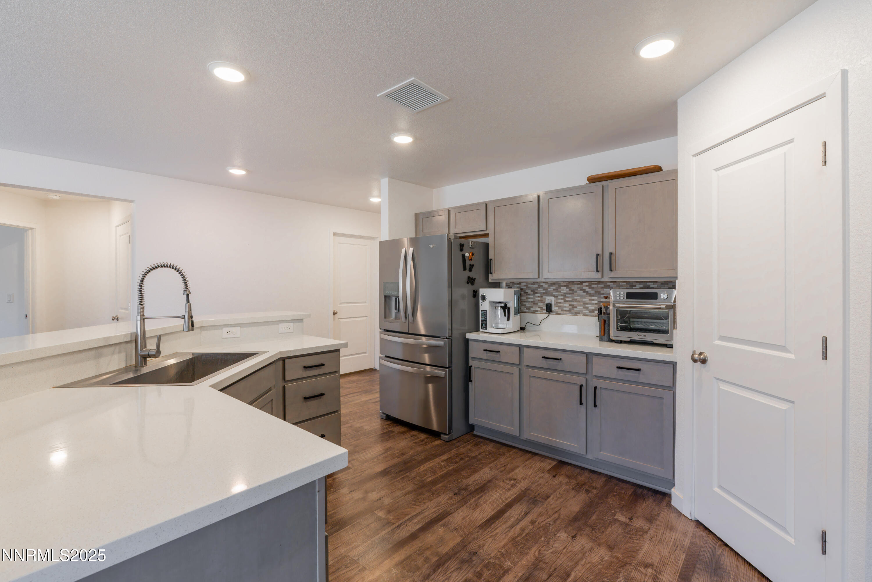 102 Halite Drive Dayton, NV 89403 - Photo 7 of 34 a kitchen that has a sink and a stove in it