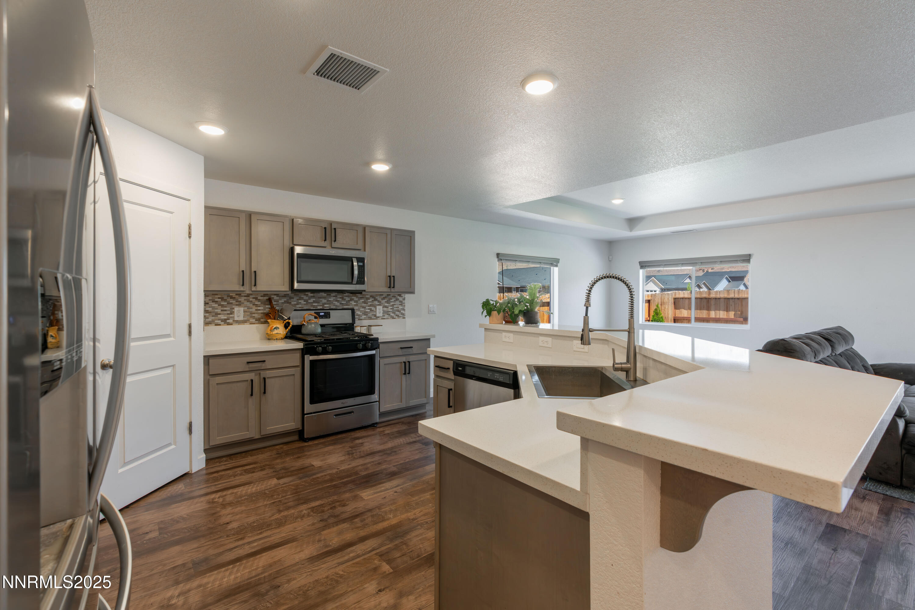 102 Halite Drive Dayton, NV 89403 - Photo 8 of 34 a kitchen with a stove a refrigerator and a stove top oven