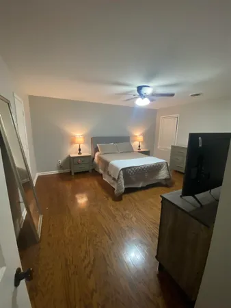 a bedroom with two beds and painted walls