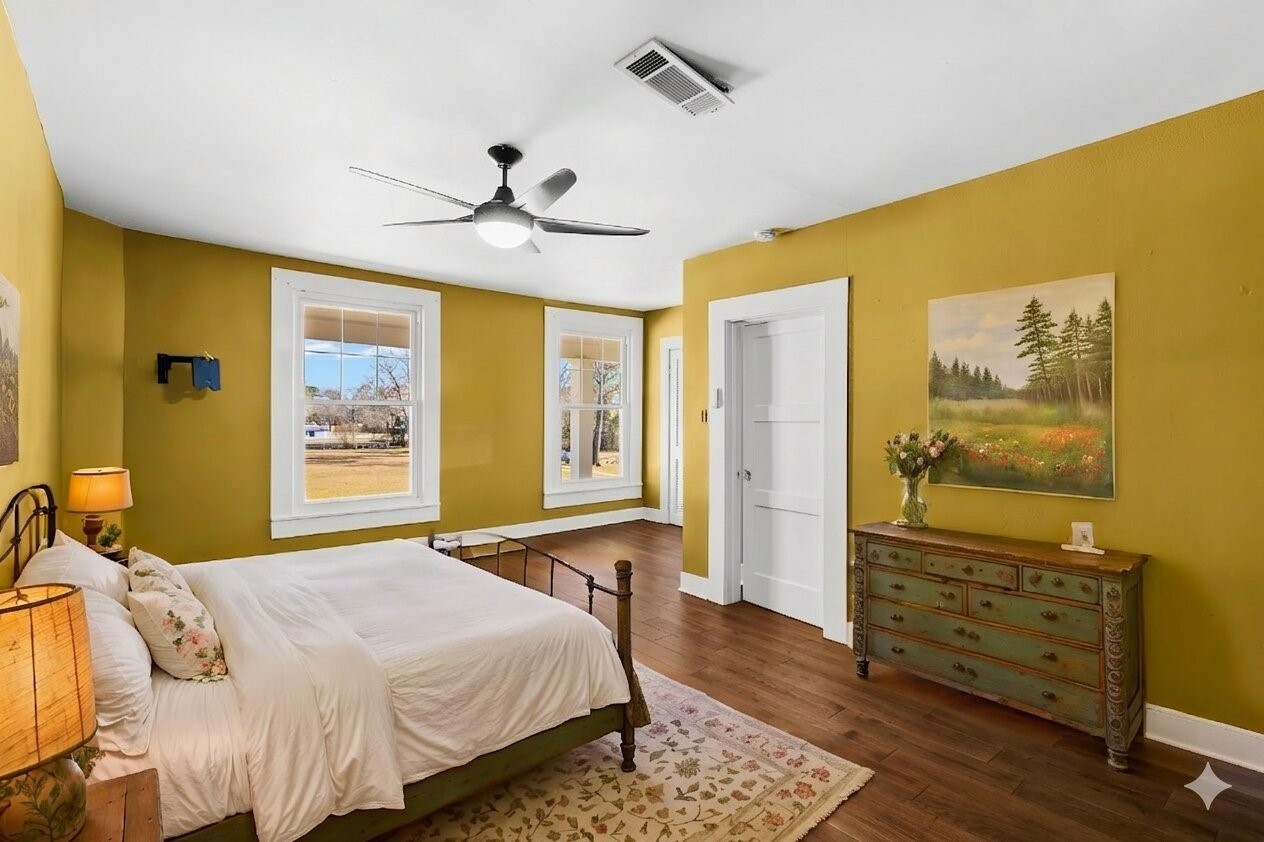500 Highway 156 Point Blank, TX 77364 - Photo 25 of 50 a bedroom with a bed and wooden floor