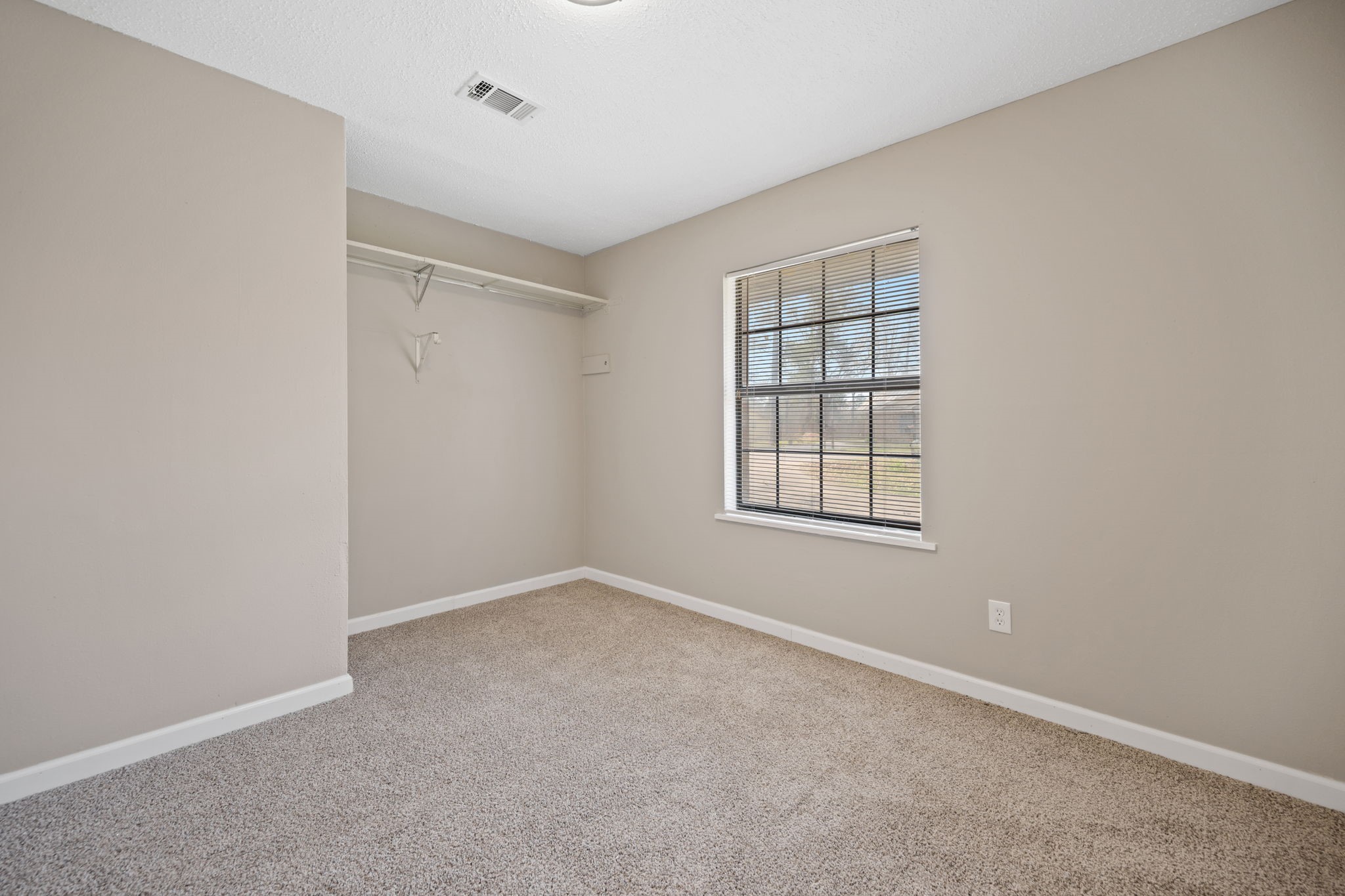 61 Beeson Avenue Shepherd, TX 77371 - Photo 11 of 14 a view of an empty room with a window