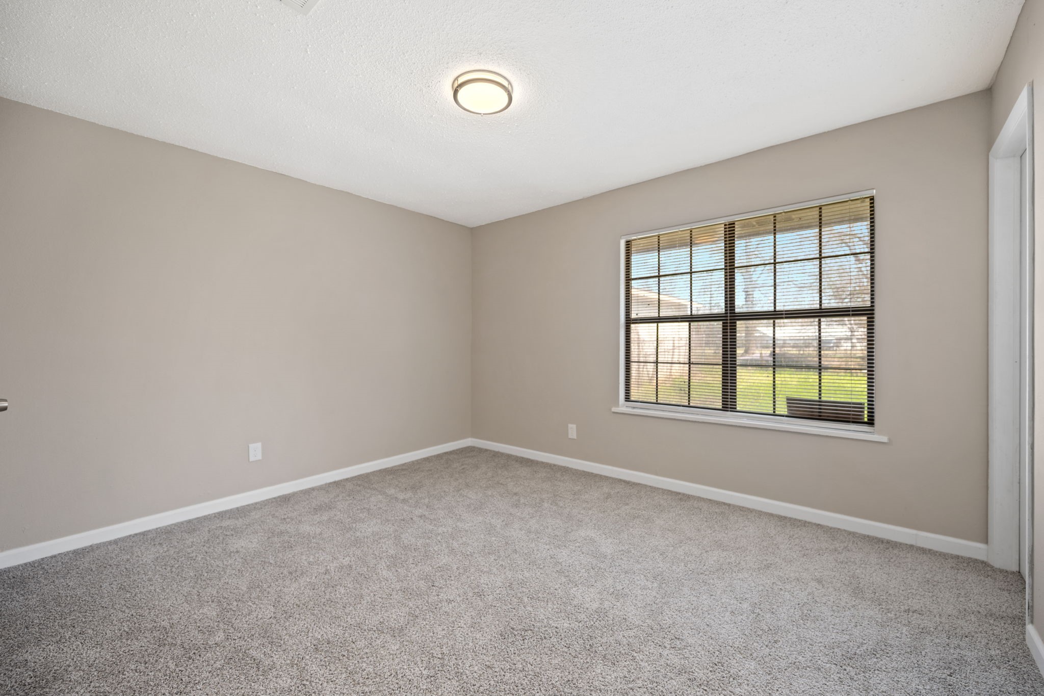 61 Beeson Avenue Shepherd, TX 77371 - Photo 13 of 14 an empty room with a window