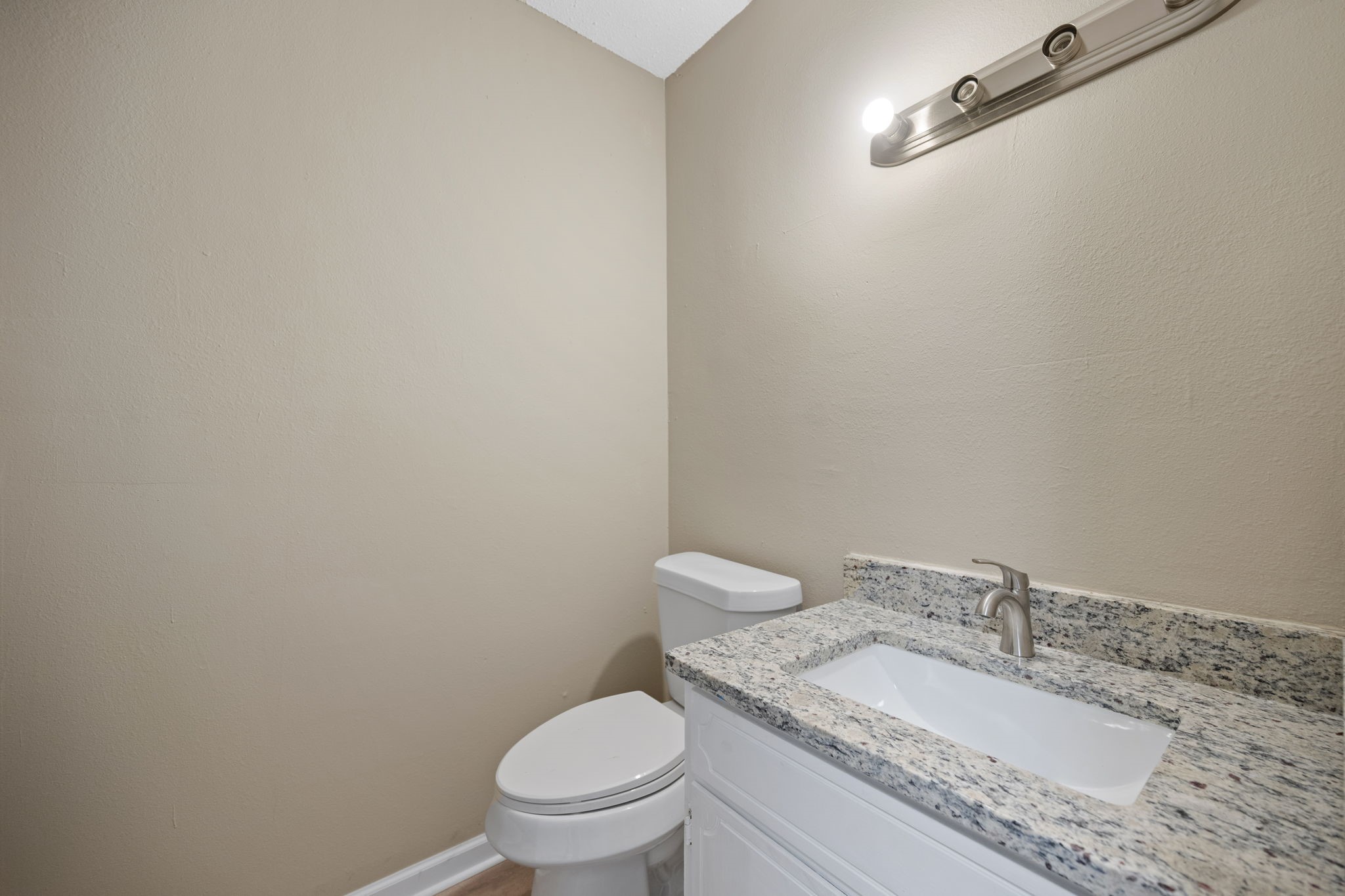 61 Beeson Avenue Shepherd, TX 77371 - Photo 14 of 14 a bathroom with a granite countertop toilet and a sink
