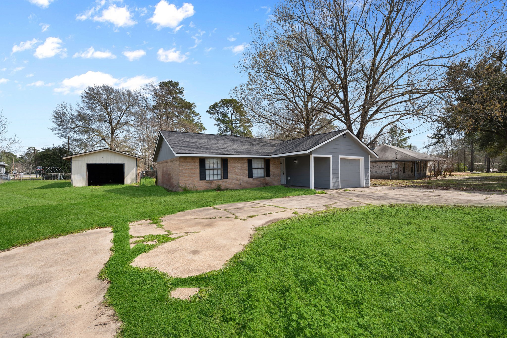 61 Beeson Avenue Shepherd, TX 77371 - Photo 2 of 14 a front view of a house with garden