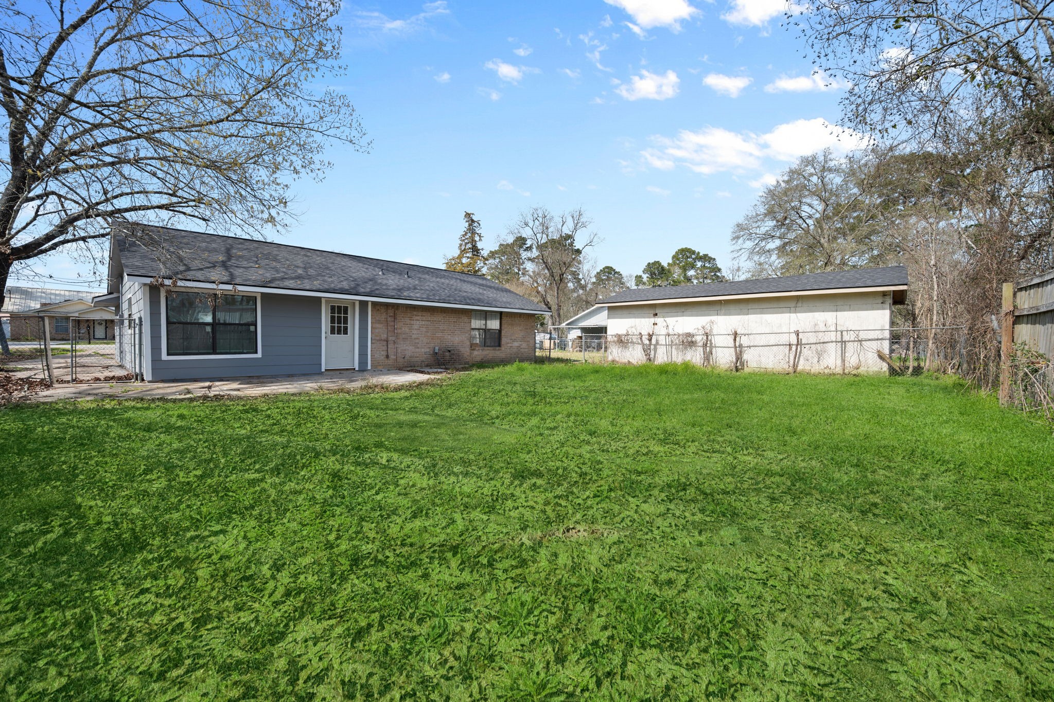 61 Beeson Avenue Shepherd, TX 77371 - Photo 4 of 14 a view of a house with a backyard