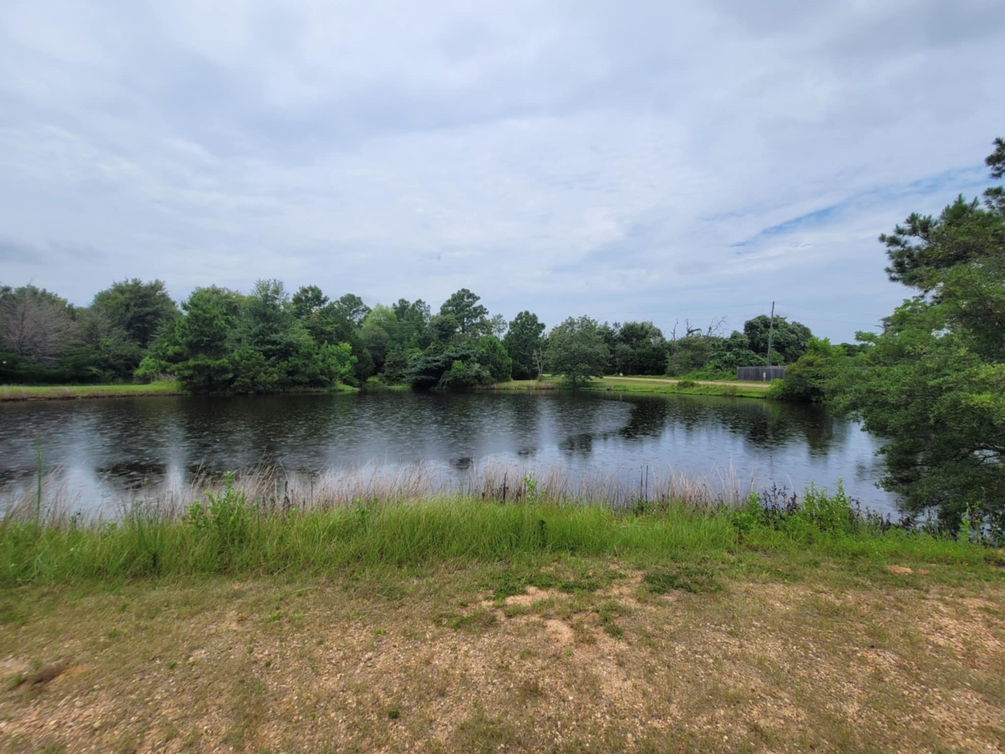 Lot 35 Redwood Hempstead, TX 77445 - Photo 6 of 9 a view of a lake with houses in the back