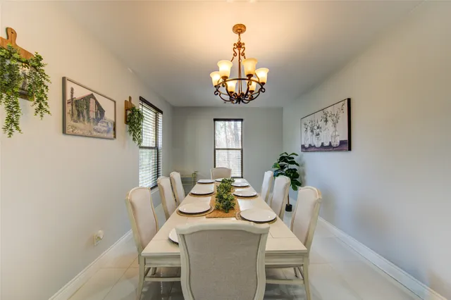 a view of a dining room with furniture and window