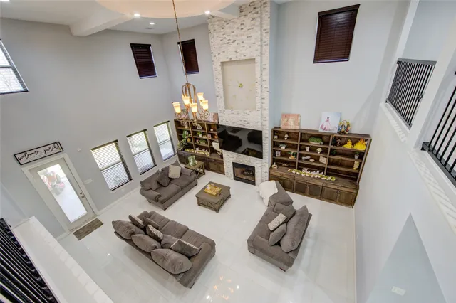 a view of a livingroom with furniture and a flat screen tv