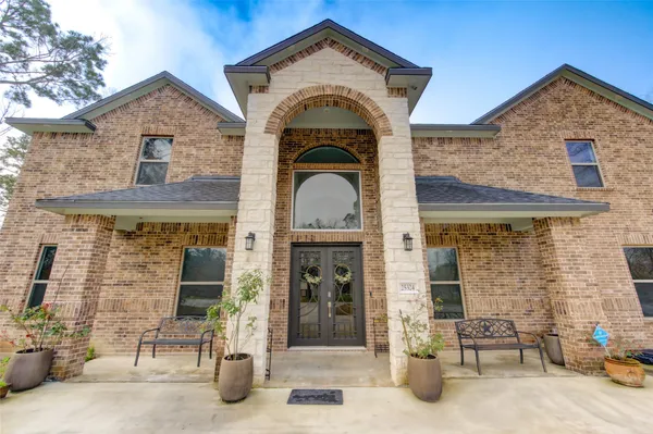 a front view of a house with glass windows