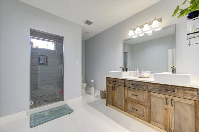 a view of living room with furniture and a chandelier