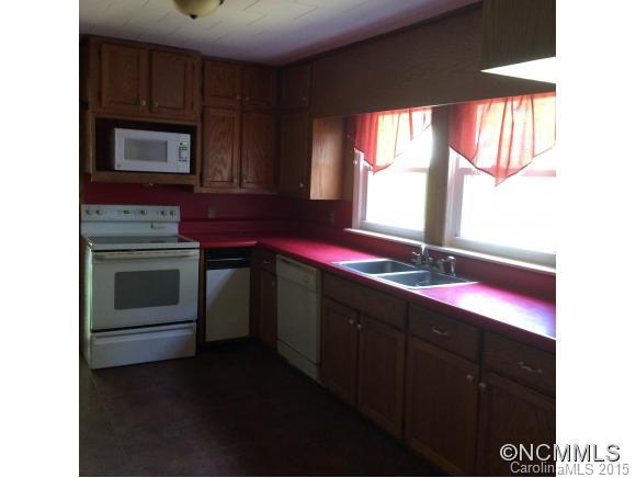 192 Green Waters Road Rutherfordton, NC 28139 - Photo 12 of 22 a kitchen with a sink stove and microwave