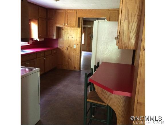 192 Green Waters Road Rutherfordton, NC 28139 - Photo 13 of 22 a kitchen with refrigerator and window