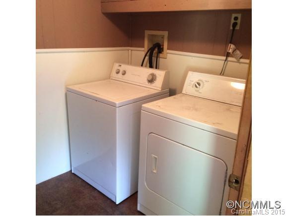 192 Green Waters Road Rutherfordton, NC 28139 - Photo 22 of 22 a open kitchen with a sink and a mirror