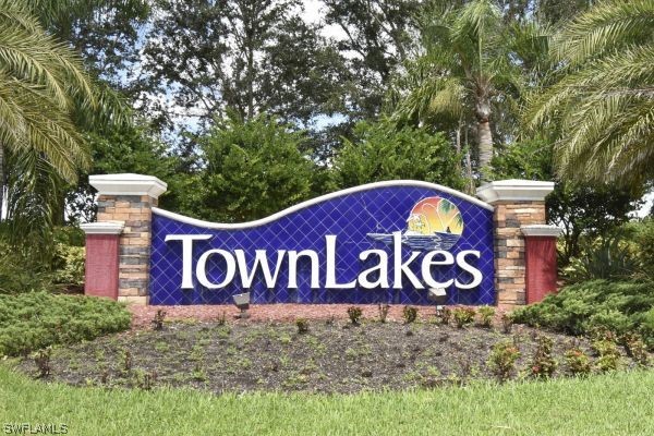 a sign that is on a brick wall