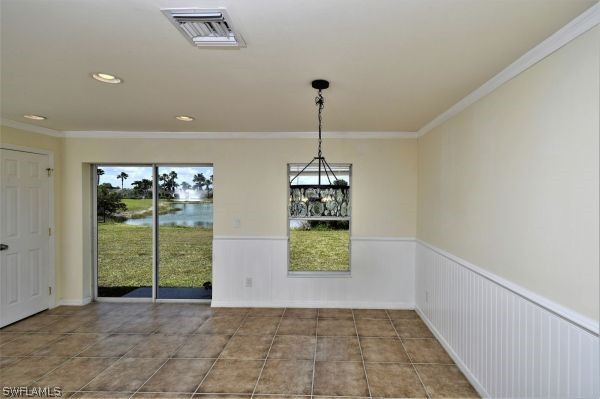 8180 Liriope Loop Lehigh Acres, FL 33972 - Photo 13 of 34 a view of an empty room with a window