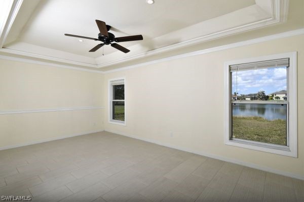 8180 Liriope Loop Lehigh Acres, FL 33972 - Photo 16 of 34 an empty room with window and ceiling fan