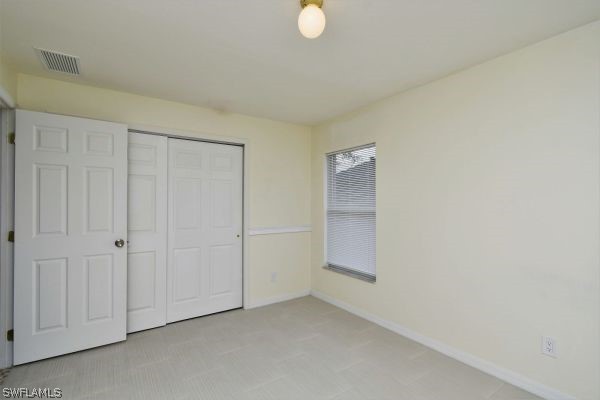 8180 Liriope Loop Lehigh Acres, FL 33972 - Photo 19 of 34 a view of an empty room