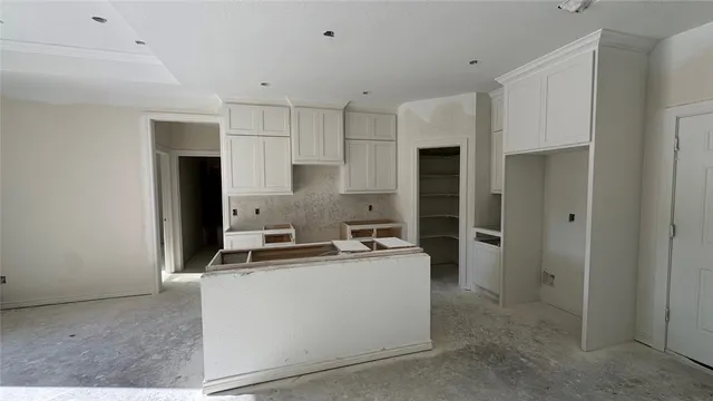 a kitchen that has a sink and a stove in it