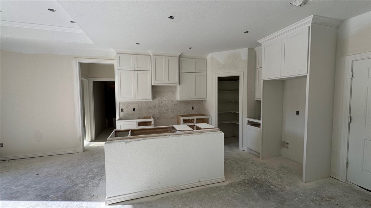 602 7th Street Navasota, TX 77868 - Photo 3 of 4 a kitchen that has a sink and a stove in it