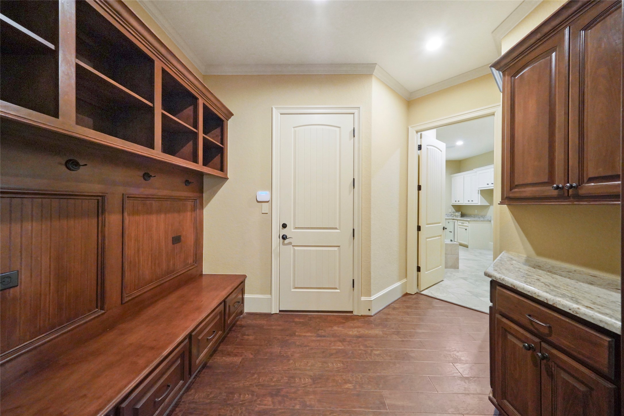 18 Rugged Lark Circle Tomball, TX 77377 - Photo 20 of 50 Mud Room with built area for storage baskets, backpack/jacket hooks, wired for laptop/phone charging and additional corner storage.