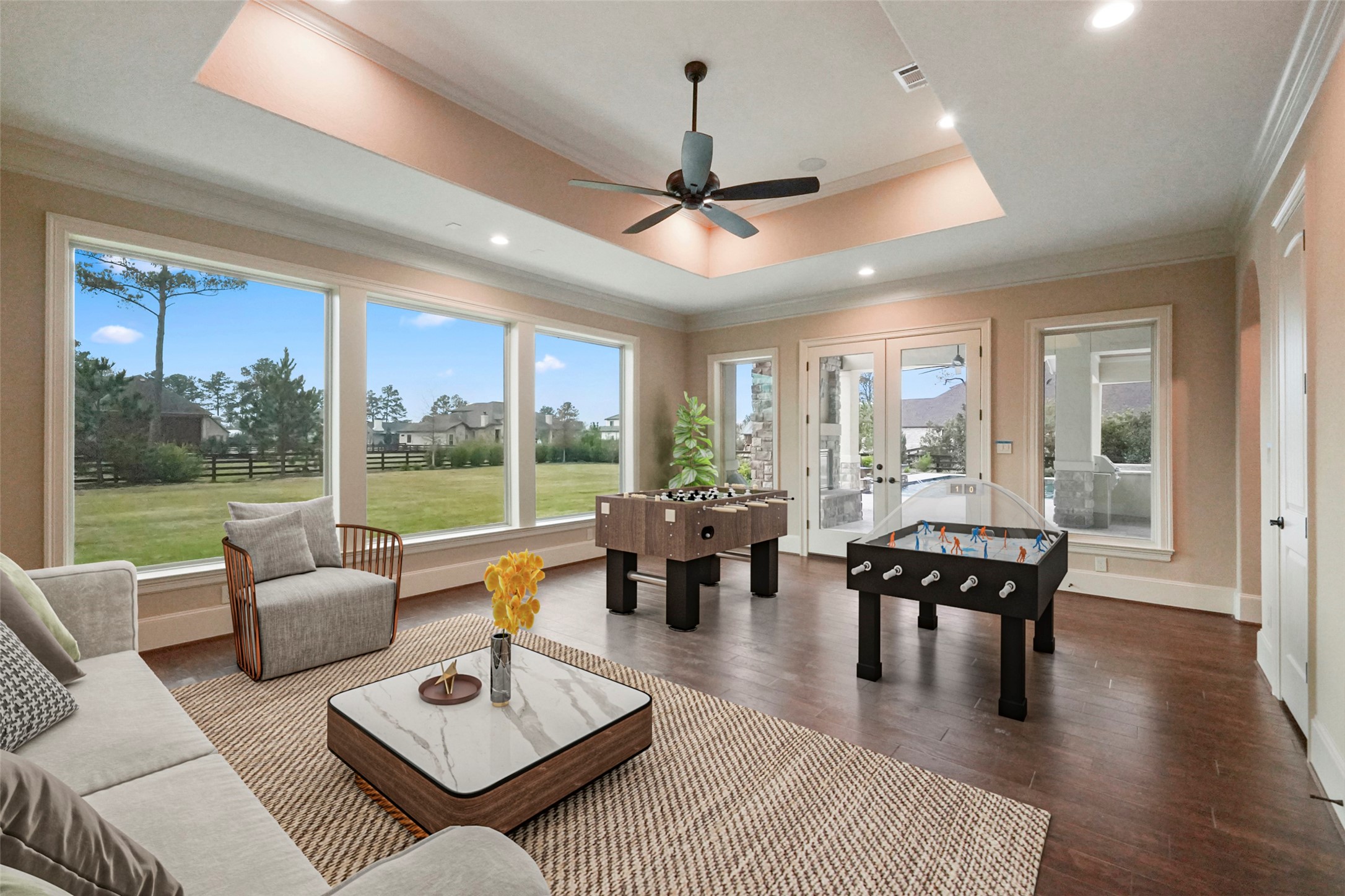 18 Rugged Lark Circle Tomball, TX 77377 - Photo 25 of 50 Gameroom has easy access to Outdoor Entertainment Area. While having fun enjoy this magnificent view of the Outdoors. This photo is virtually staged. Wired for television and sound system.